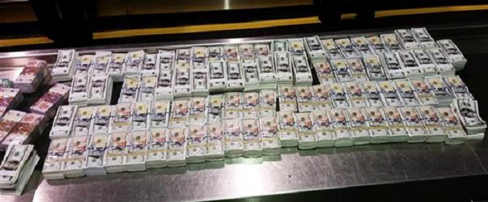 Couple smuggled millions in `Hell Money` Into U.S. -officials